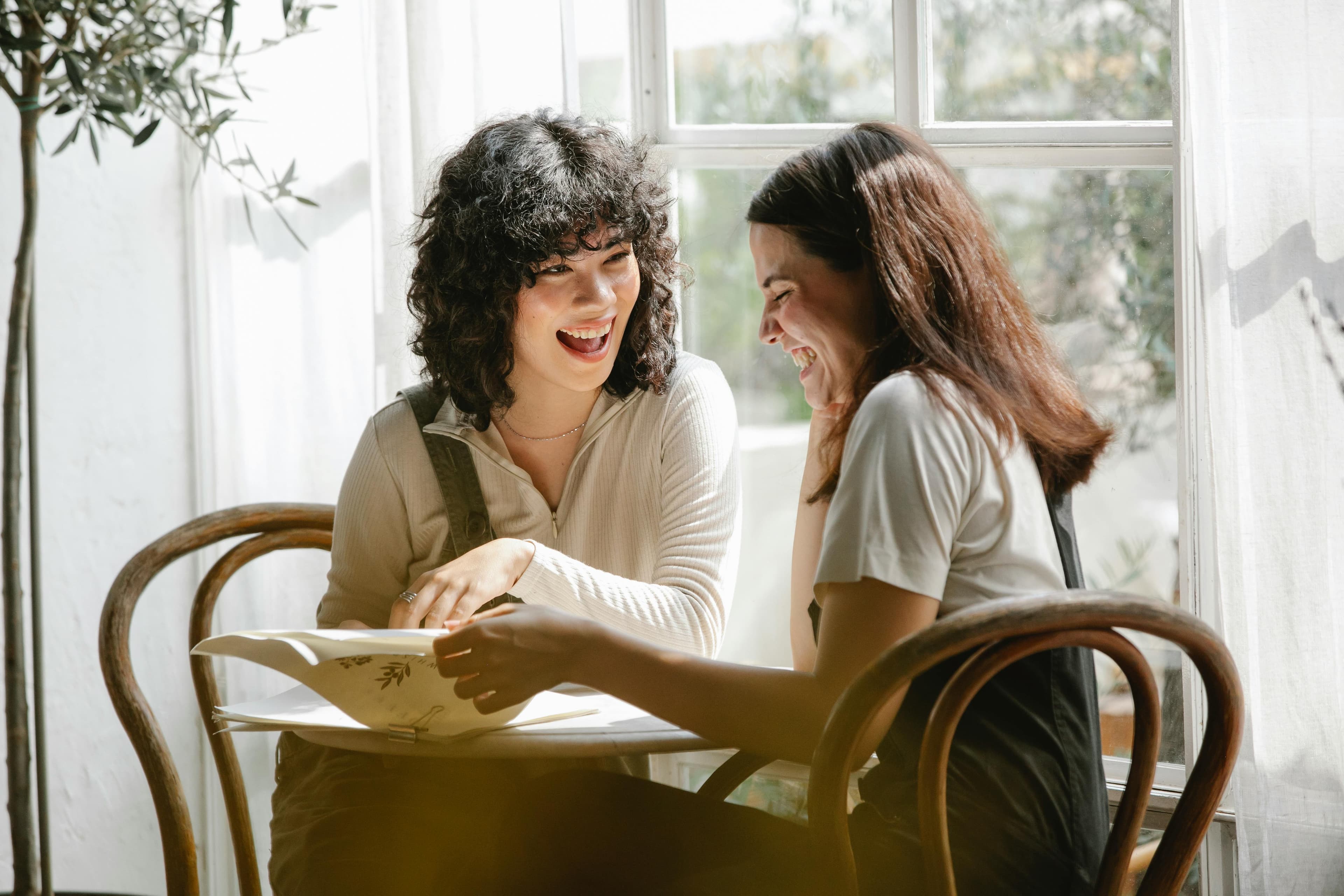 Two women laughing together